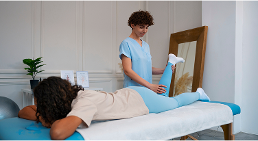 Physical therapist performing leg stretch on patient